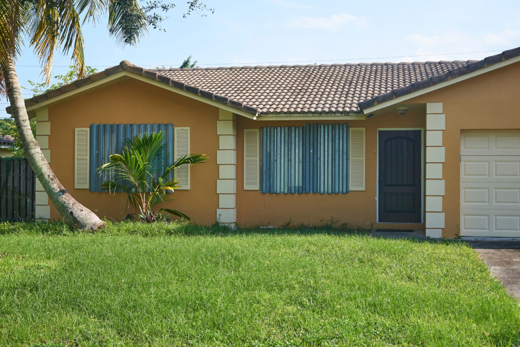 House with storm shutters- Hurricane Season 2023 blog featured image