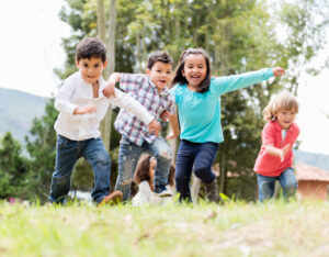 Image of kids playing outside- Child Life Insurance blog featured image