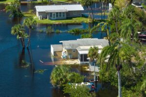 Image of houses flooding in a tropical location: Florida Flood Zone Map Blog featured image