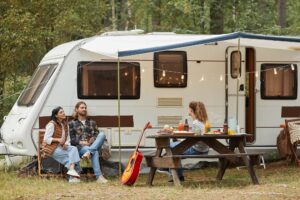 Image of 3 people RV camping- RV Insurance blog featured image